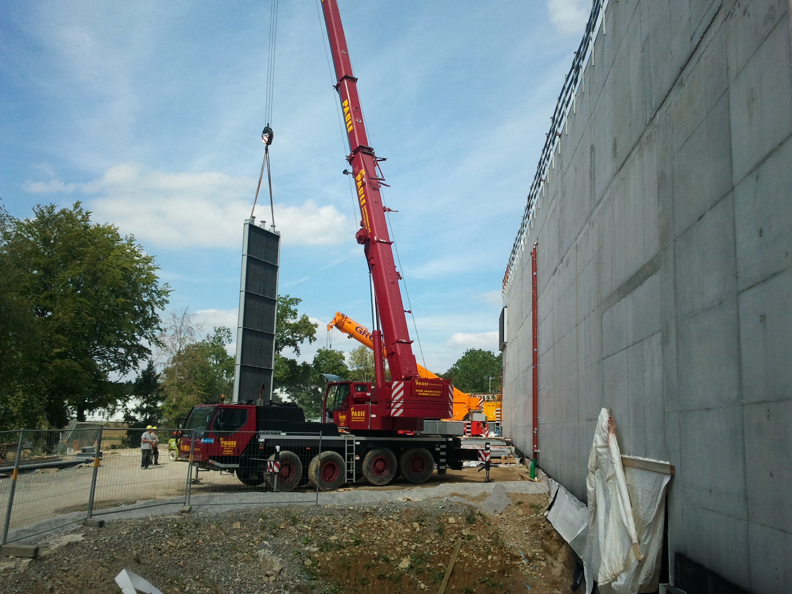 Wind tunnel heat exchanger installation by crane at project site